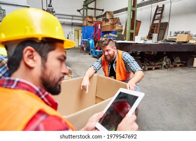 Specialist Warehouse Clerk Checks Incoming Goods On The Tablet Computer In The Shipping Company's Warehouse