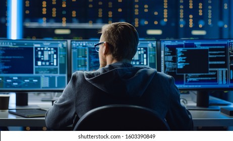 IT Specialist Working on Personal Computer with Monitors Showing Coding Language Program. Technical Room of Data Center with Server Rack. - Shutterstock ID 1603390849