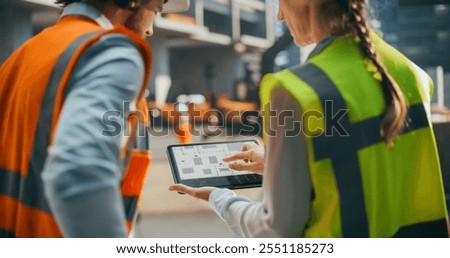 Specialists Using Tablet with Digital Technical Drawing Blueprints on Screen. Female Civil Engineer and an Architect Having a Conversation During an Outdoors Meeting at a Building Site Area