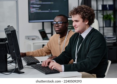 IT specialists writing codes for new software