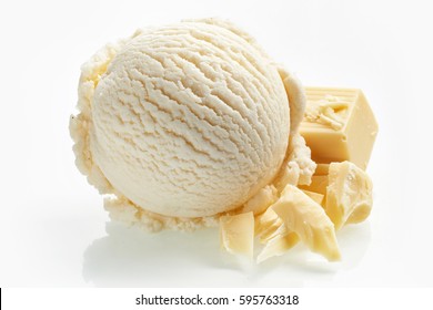 Speciality white milk chocolate ice cream in a single scoop with pieces of of a candy bar alongside as an ingredient isolated on white