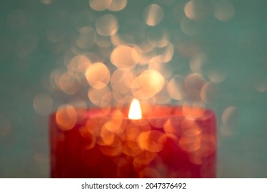 Specially defocused photo, blur. The candle is burning. Candle light and beautiful bokeh.