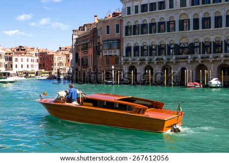 A specific water taxi on The Grand Canal in Venice.