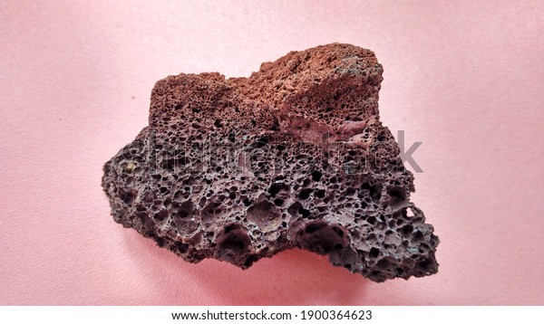 specimen\
Scoria igneous rock, black and brownish red color from the central\
java volcano, Indonesia. Basaltic lava, oxidation of iron during\
eruptions. Rocks and minerals identification\
