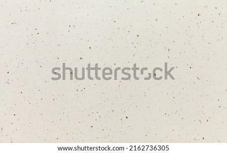 Speckled organic confetti paper background. Seamless pattern surface decorative design for background for banner, wallpaper, poster.