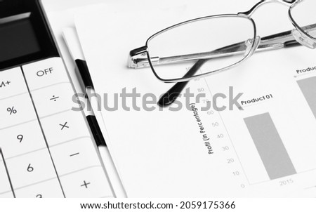 Spectacles on financial statement and balance sheeet. Business concept.