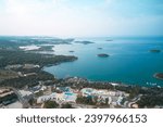 Spectacular aerial view of the sea coast in Croatia near the town of Porec with camping area. Shot from a drone.