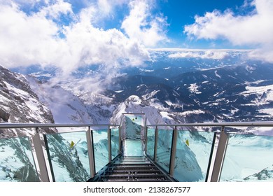 Spectacular alpine view with the Stairscase to Nowhere on the snowy Dachstein summit, Schladming, Styria, Austria. Pure thrill combined with a magnificent view.