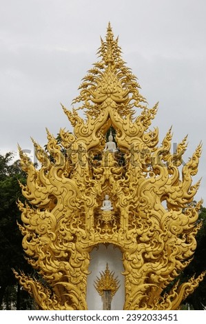 A spectacular archway with artistic details within the famous Wat Rong Khun Temple in Chiang Rai Province, Thailand