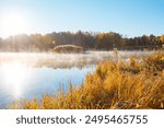 Spectacular autumn day on a quiet lake surrounded by a forest. Location place Small Polissya, Ukraine, Europe. Fresh, bright colors on the lake. Perfect photo wallpaper. Discover the beauty of earth.