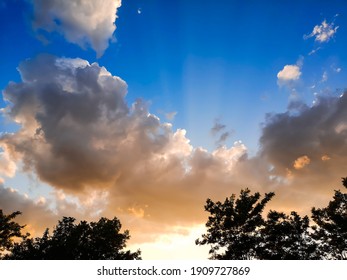 Spectacular blue sky with mistic clouds and rays of lights