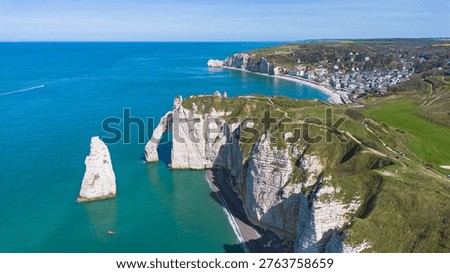 Spectacular drone view of Étretat, featuring the three arches and the cliffside golf course in Normandy, France