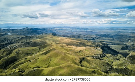 Spectacular Elevated Perspective Capturing Sweeping Countryside With Gentle Hills And Sunlit Plains