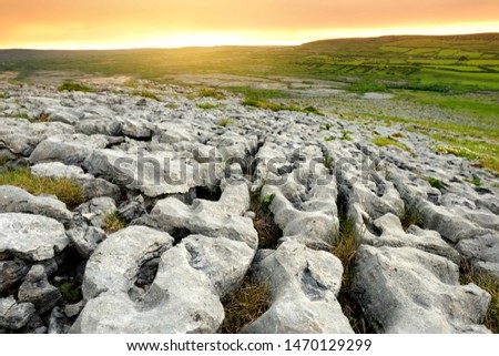 Spectacular landscape of the Burren region of County Clare, Ireland. Exposed karst limestone bedrock at the Burren National Park. Rough Irish nature.