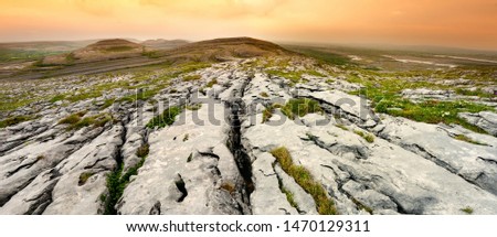Spectacular landscape of the Burren region of County Clare, Ireland. Exposed karst limestone bedrock at the Burren National Park. Rough Irish nature.