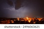 Spectacular Night thunderstorm storm with lightning bolt strike thunder above Czech town