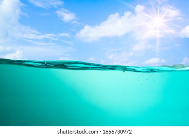 Spectacular ocean waves stop steaming with separate bubbles on a bright sky background. Popular corners, natural concepts - Shutterstock ID 1656730972