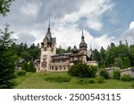 Spectacular Peles Castle situated in Sinaia, Romania. Neo-Renaissance castle in the Carpathian Mountains surrounded by forest. Constructed for King Carol I. Famous travel destination. 