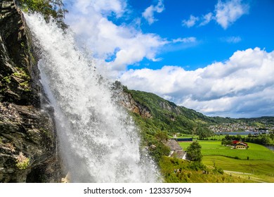 Spectacular Steinsdalsfossen Waterfall In Nordheimsund Hardanger On The Fosselva River,Near Bergen, Summer In Norway