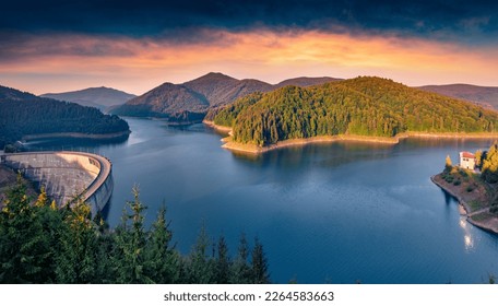 Spectacular summer sunrise on Dragan lake. Adorable morning view of Apuseni Natural Park. Incredible outdoor scene of Romania, Europe. Beauty of nature concept background.