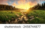 Spectacular sunrise over a scenic landscape with colorful clouds, trees, grasslands and water reflecting the golden sunlight