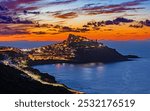 Spectacular sunset over the medieval town of Castelsardo, Province of Sassari, Sardinia, Italy, Europe.