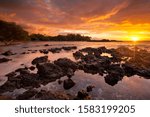 Spectacular sunset at Waialea Beach or Beach 69 on the Kohala Coast of Big Island Hawaii, USA.