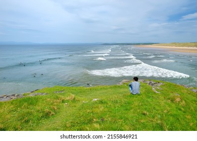 Spectacular Tullan Strand, one of Donegal's renowned surf beaches, framed by a scenic back drop provided by the Sligo-Leitrim Mountains. Wide flat sandy beach in County Donegal, Ireland.