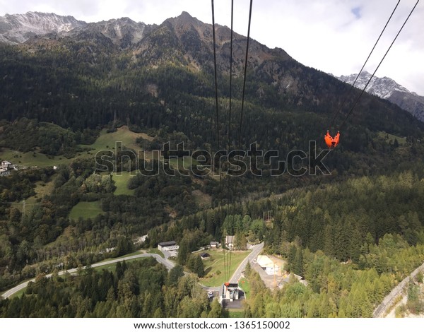 Spectacular view of the Bregaglia Valley\
in Switzerland from the cable car to the Albigna\
dam