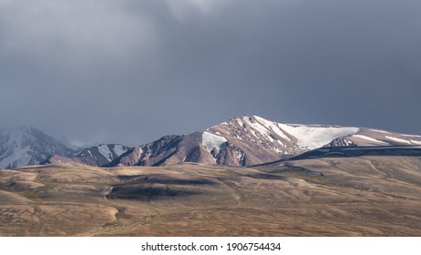 Spectacular view on snow-capped mountains from high-altitude Khargush pass in Gorno-Badakshan, the Pamir region of Tajikistan - Powered by Shutterstock