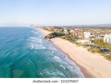 Spectacular view over Burleigh beach and North Burleigh on the  Gold coast with infinite beach, nice waves in the ocean and people walking.