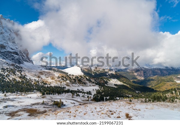 Spectacular view of Sella mountain Group with Sas\
Pordoi summit (and the cable car station on the top) as seen from\
Passo Pordoi, Dolomites, Trentino, Alto-Adige, Bolzano, Trento,\
South Tyrol, Italy