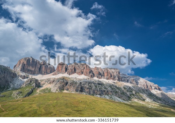 Spectacular view of Sella mountain Group with Sas Pordoi\
summit (and the cable car station on the top) as seen from Passo\
Pordoi, Dolomites, Trentino, Alto-Adige,\
Bolzano, Trento, South\
Tyrol, Italy 
