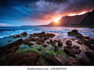 Spectacular view of the volcanic coast with lava rocks. Location place cape San Vito, nature reserve Monte Cofano, Sicilia, Italy, Europe. Picturesque photo wallpaper. Discover the beauty of earth. - Shutterstock ID 2303839321
