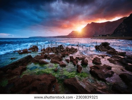 Spectacular view of the volcanic coast with lava rocks. Location place cape San Vito, nature reserve Monte Cofano, Sicilia, Italy, Europe. Picturesque photo wallpaper. Discover the beauty of earth.