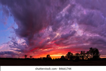 A Spectacular, Vivid Stormy Sky At Sunset In The American Midwest (Indiana). Photographed Just After The Sun Dipped Below The Horizon And After As Storm Clouds Were Dissipating.