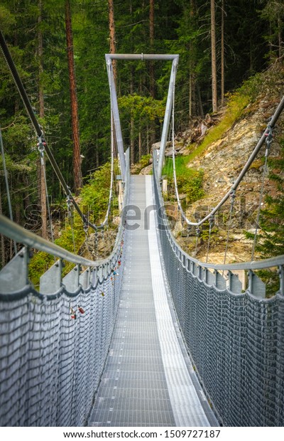 spectacular walk over the steel rope bridge in\
Laengenfeld, Oetztal, Tirol,\
Austria