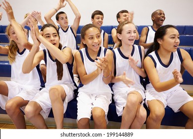 Spectators Watching High School Basketball Team Match