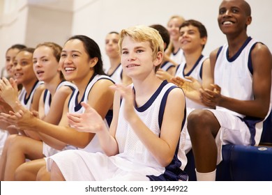 Spectators Watching High School Basketball Team Match