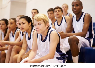 Spectators Watching High School Basketball Team Match