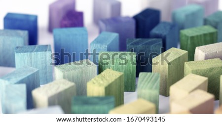 Spectrum of colorful wooden blocks.  Background image or cover for something creative or a diverse. Muted color. 