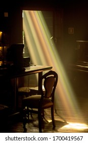 spectrum of light through a window into a dark room