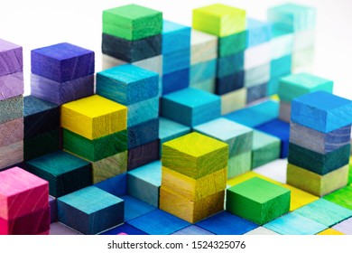 Spectrum of stacked multi-colored wooden blocks. Background or cover for something creative, diverse, expanding,  rising or growing. shallow depth of field. - Shutterstock ID 1524325076