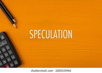 SPECULATION - word (text) on a yellow wooden background, a calculator and a pencil. Business concept (copy space). - Shutterstock ID 2203155963