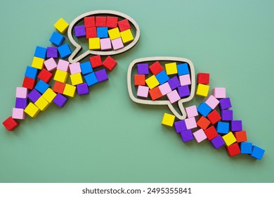 Speech bubble and colorful cubes. Inclusive language concept.
