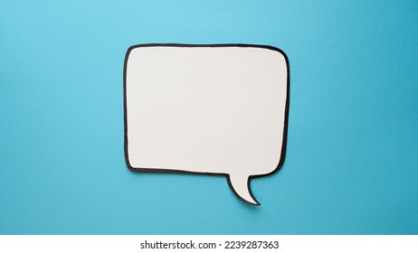 Speech bubble on a blue background. Comic cloud with a place for text - Shutterstock ID 2239287363