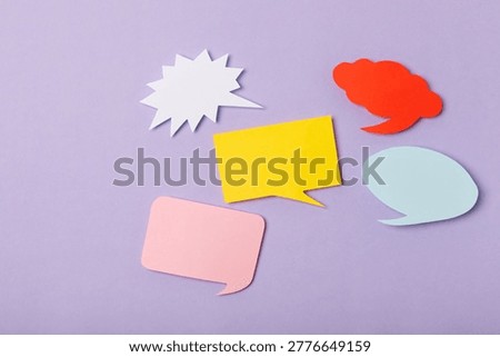 Speech bubble on a bright colored background. Empty speech bubble. Space for text. Design. Flat lay. Top view. Conceptual background.
