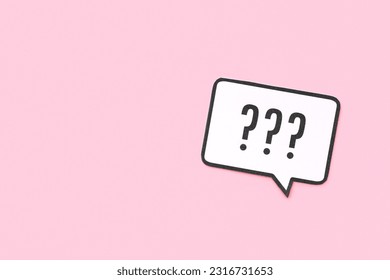 Speech bubble with question mark on pink background