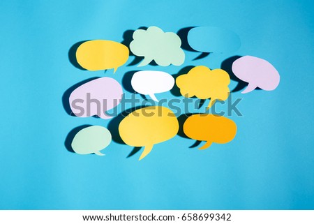 Speech bubble text message theme with hard shadow on a blue background