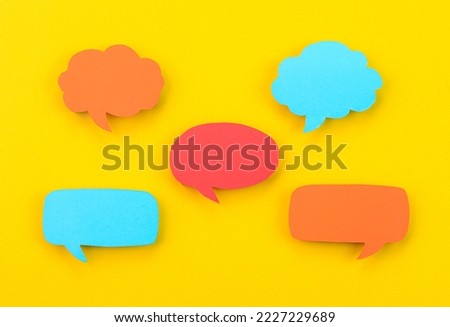 Speech bubbles arranged on a yellow background